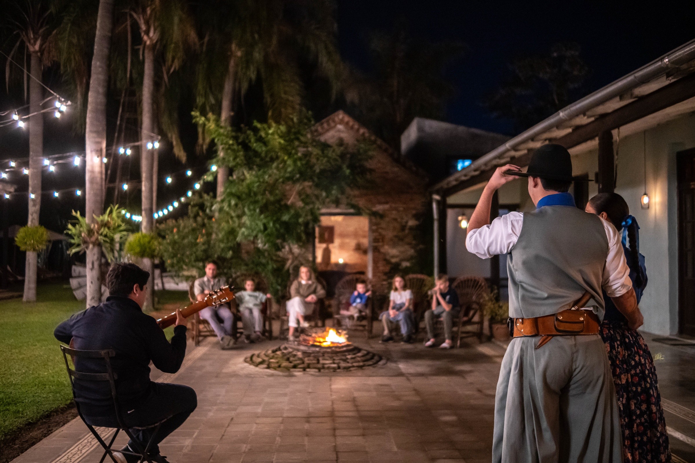 People sharing music and an evening outdoors